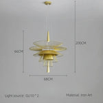 suspension lumineuse or noir contemporain minimaliste ampoule led intégrée fixation câbles métal superposé