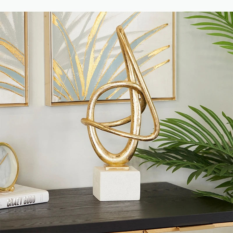 sculpture abstraite moderne or argent torsadée décoration minimaliste