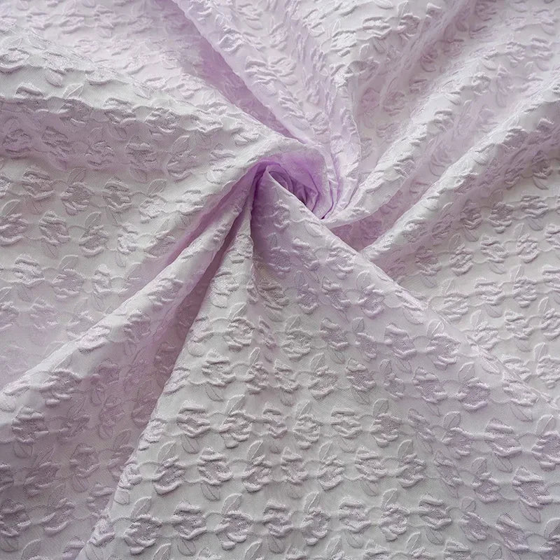 tissu polyester violet clair motifs floraux relief transparent decoratif 140cm large
