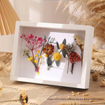 cadre photo moderne résine carré posé table mur blanc noir éléments naturels