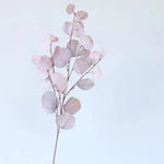 bouquet artificiel feuilles ovales moderne vase transparent support doré couleurs vives exposition intérieure