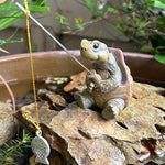 statue tortue pêche carapace hexagonale marron vert ligne jaune leurre poisson extérieur jardin decoration