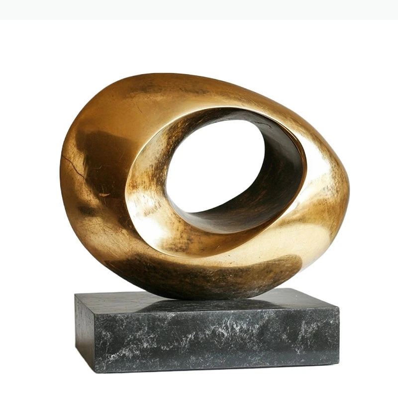 Sculptures abstraites métal doré modernes minimalistes socle noir texturées lumineuses