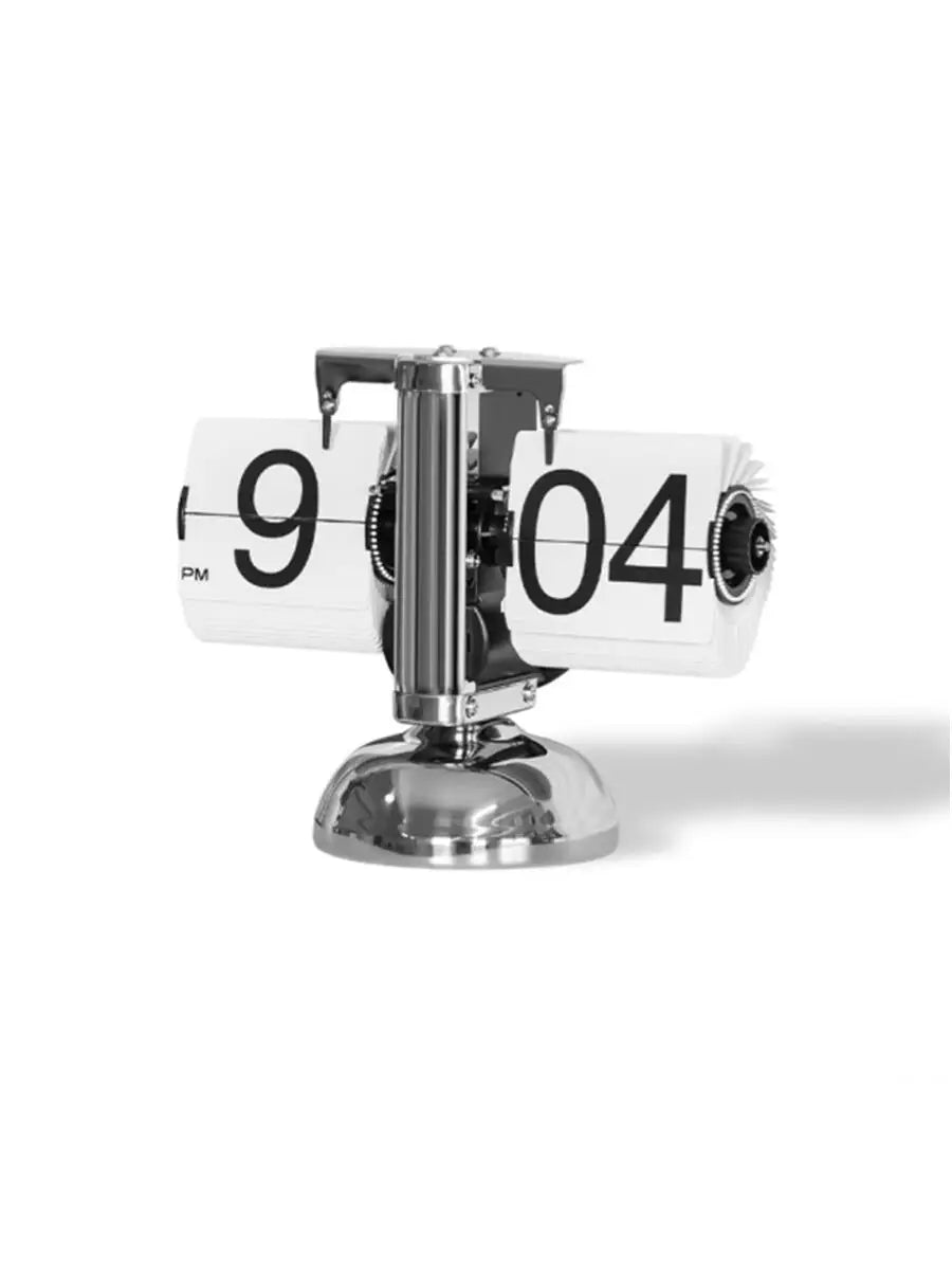 horloge numérique moderne horloge pieds boules chiffres noirs fond blanc métal brillant minimaliste affichage