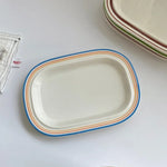 assiettes ovales rayées blanc bleu rouge vaisselle classique cuisine décoration table après midi thé
