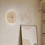 horloge murale pierre texturée minimaliste éclairage salle manger contemporaine fixée mur LED tricolore