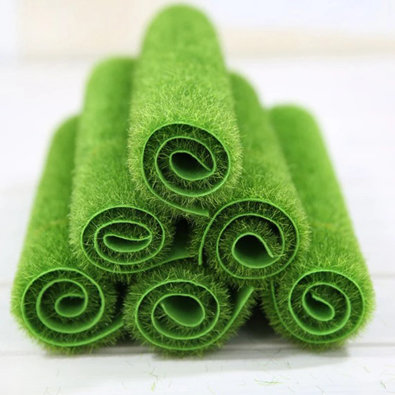 tapis imitation herbe vert texture granuleuse decoratif etoiles mer bouteilles clôture fleurs calla jouets