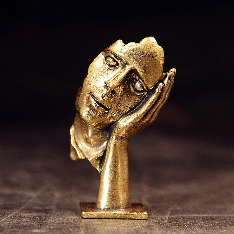 statuette abstraite dorée sculpture visage stylisé moderne décoration salon maison