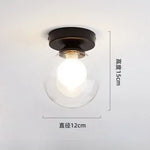 lampe moderne verre transparent noir doré élégante sphérique éclairage contemporain