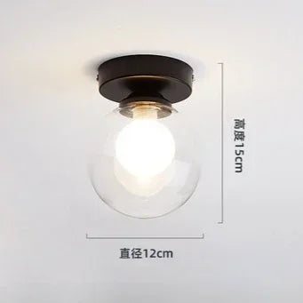 lampe moderne verre transparent noir doré élégante sphérique éclairage contemporain