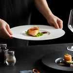 assiettes rondes rayures verticales moderne noir blanc céramique