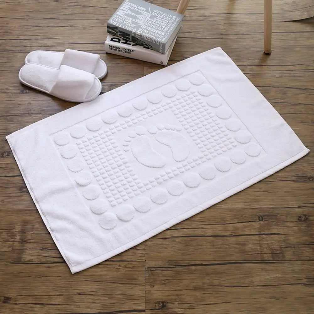 tapis bain moderne blanc motifs pieds géométriques salle bain absorbant coton décoration cheveux fleurs