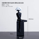 statuette décorative buste féminin noir blanc bleu or moderne minimaliste.surface lisse polie.formes arrondies socle