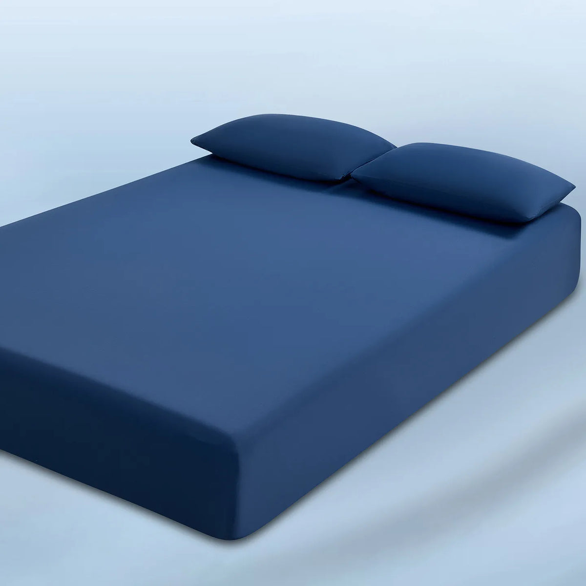 parure lit bleu clair drap housse élastique deux oreillers coton doux chambre moderne