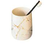 ensemble porte brosse dents porte savon marbre moderne or noir élégant bouteille parfum fleurs