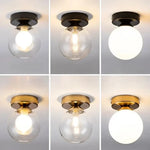 lampe moderne verre transparent noir doré élégante sphérique éclairage contemporain