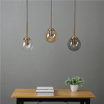 suspension lumineuse transparente moderne ampoule brillante câble noir minimaliste chambre salon étude