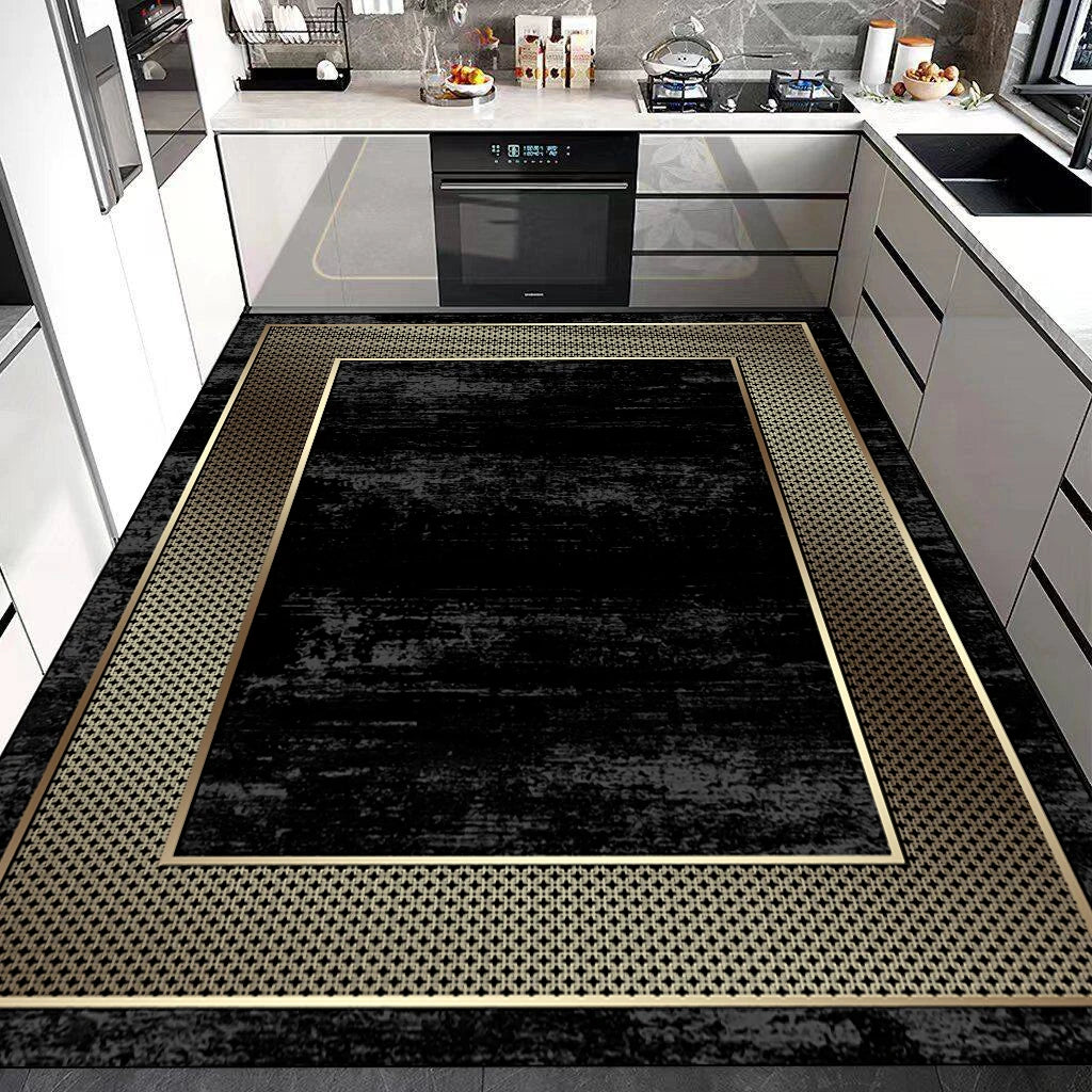 Cuisine moderne avec mobilier blanc, électroménagers encastrés noirs et tapis design en noir et beige.