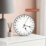 horloge murale noire cadran blanc aiguilles noires système horaire atypique