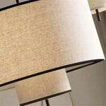 lampe suspendue moderne abat jour tissu texture lin trois tailles différentes lumière chaude blanc
