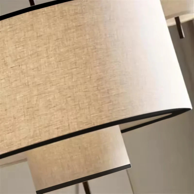 lampe suspendue moderne abat jour tissu texture lin trois tailles différentes lumière chaude blanc