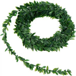 guirlande végétale artificielle vert feuilles ovales fleurs blanches décoration extérieure mariage anniversaire bohème champêtre