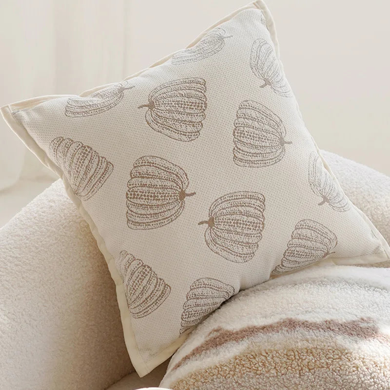 coussin motif feuilles stylisées beige clair moderne opacité 45x45cm franges fixation
