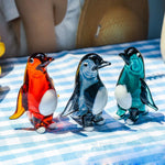 statuettes manchots transparents artisanales couleur verte orangée noire