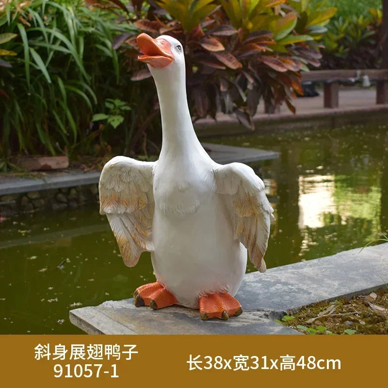 statue canard blanc plumes orange piscine jardin décoration extérieure animaux ornements paysagistes fleurs artificielles