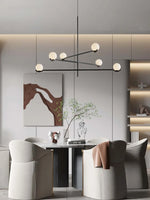 suspension lumineuse moderne sphères blanches structure noire led neutre lumière blanc noir