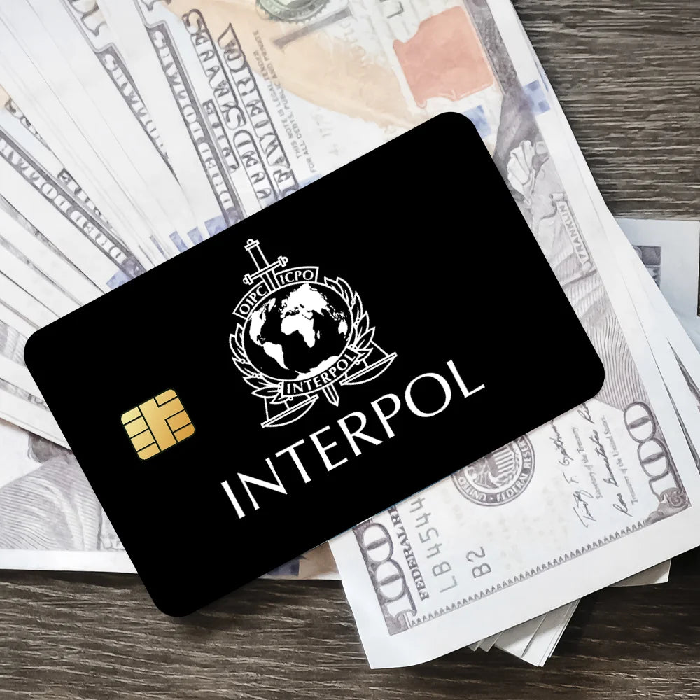 stylo bille bleu interpol logo globe épée carte bancaire