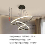 suspension lumineuse moderne or blanc anneaux superposés intérieur chambre salon