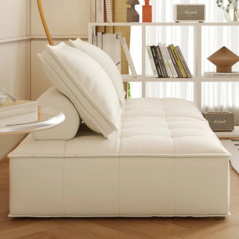 canapé lit moderne cuir noir blanc marron oreillers minimaliste salon