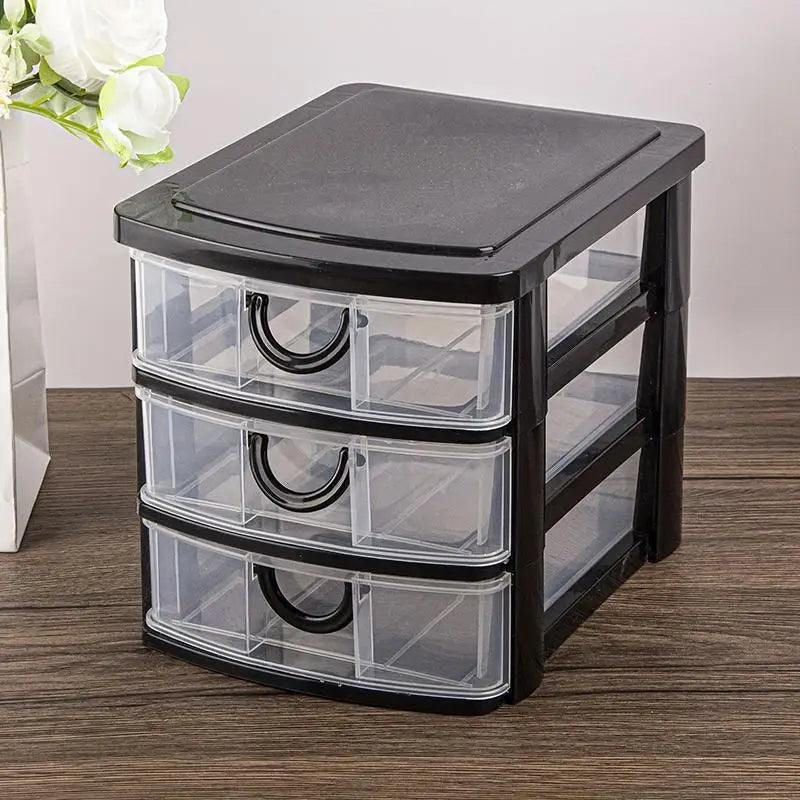 rangement tiroirs transparents meuble moderne noir câbles stylos crayons pot fleurs livres vases succulentes