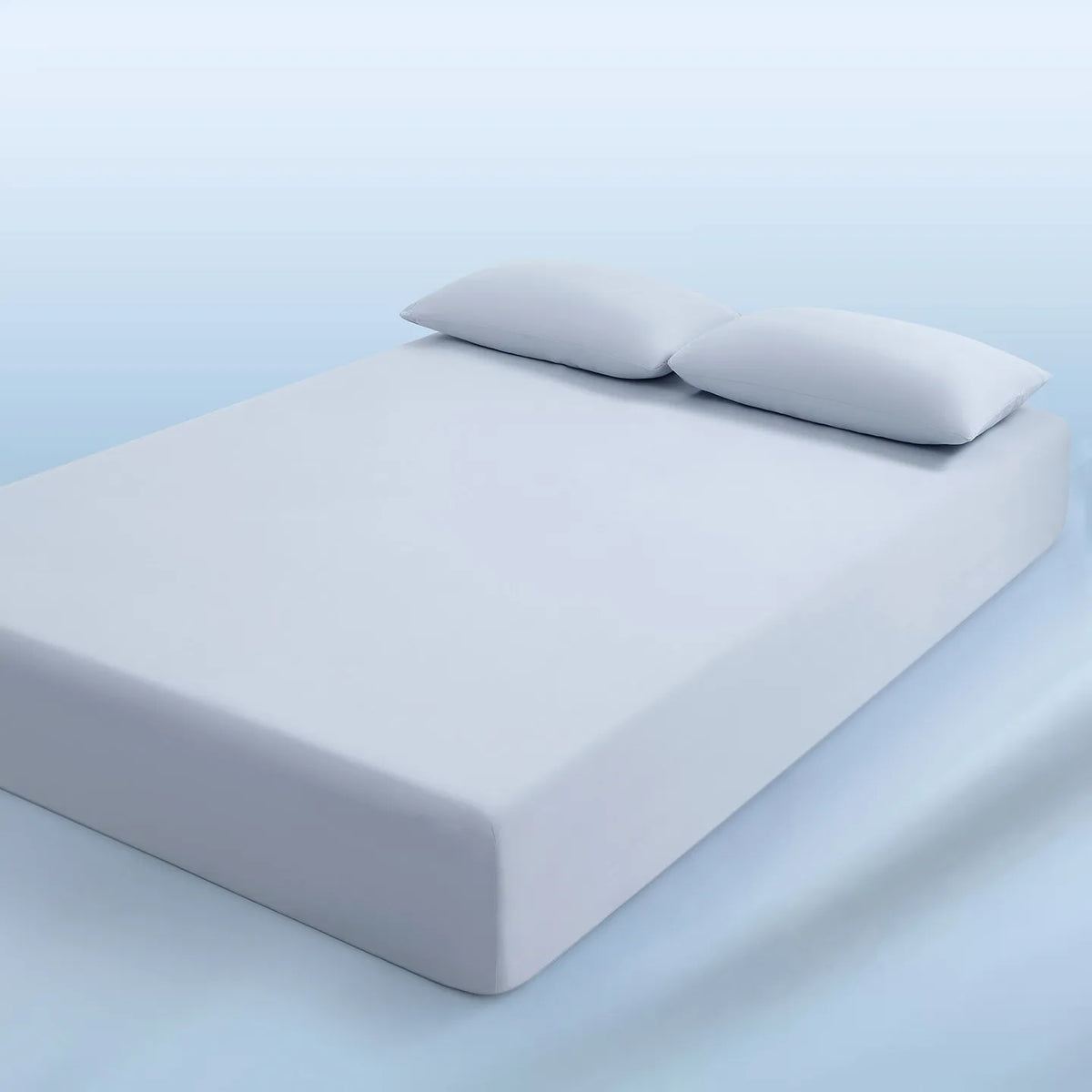 parure lit bleu clair drap housse élastique deux oreillers coton doux chambre moderne