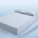 parure lit bleu clair drap housse élastique deux oreillers coton doux chambre moderne