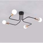 lampe suspension noir blanc moderne scandinave ampoules structure métallique fixations câbles noirs