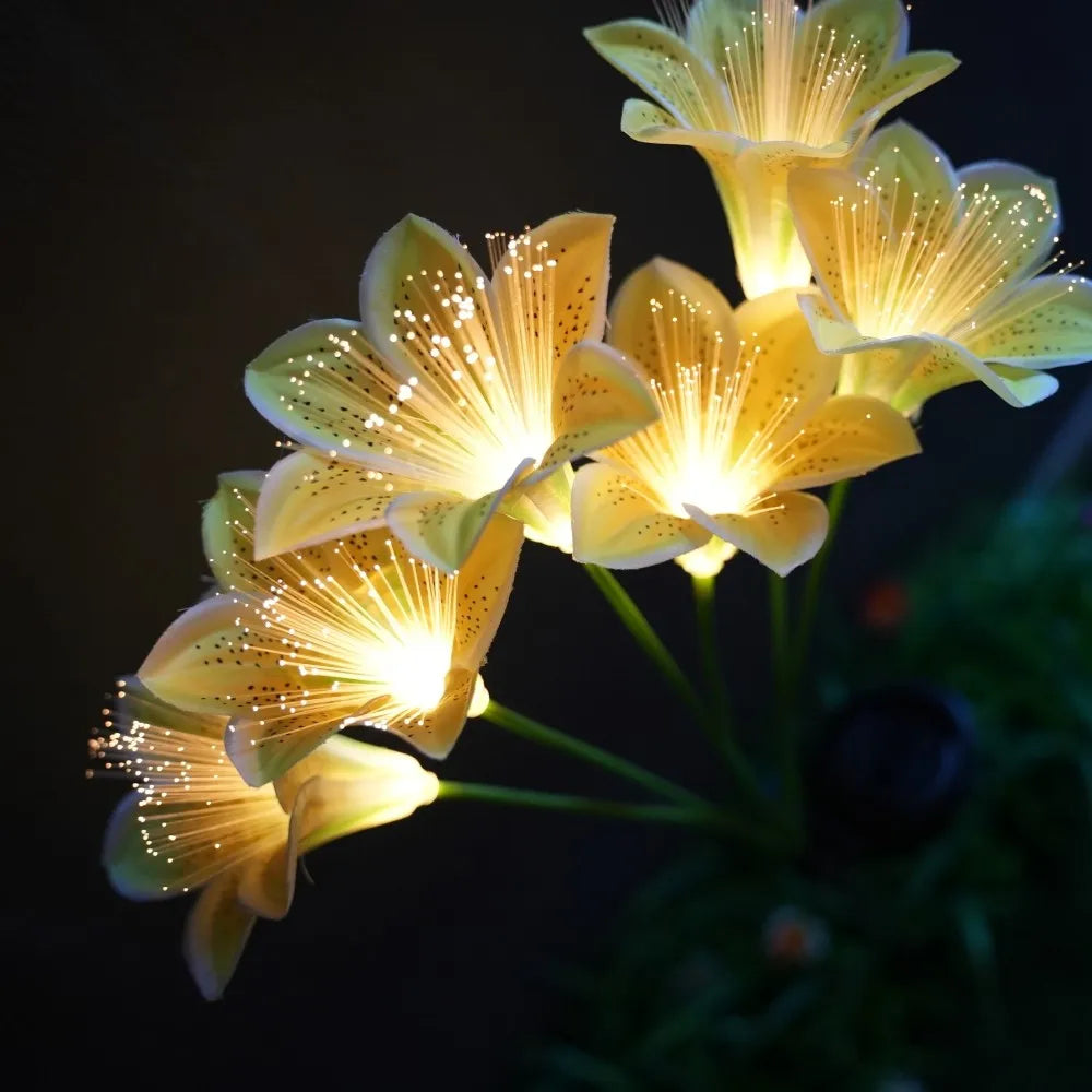 lampions solaires fleurs lys blanc jaune rose modernes extérieurs patio jardin piquet métallique led
