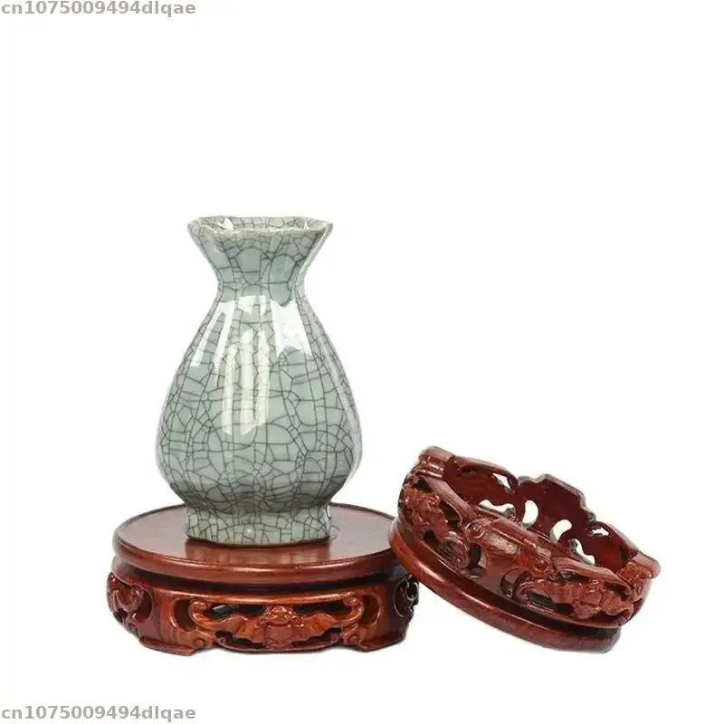 support bois sculpté motifs floraux artisanal decor maison marron foncé tranchant deco vase pot