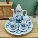 service thé miniature blanc bleu fleurs classique théière crème sucrier tasses assiettes