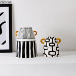 vase céramique rayures noires blanches moderne décoration intérieure arrangement fleurs artificielles minimaliste