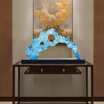 sculpture abstraite moderne bleu clair texture ondulée translucent base noire
