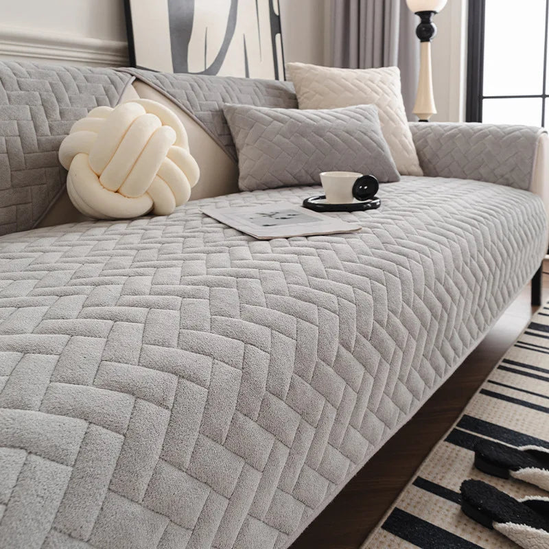 Un canapé douillet et confortable, recouvert de coussins moelleux aux motifs géométriques, offrant un espace de détente et de relaxation.