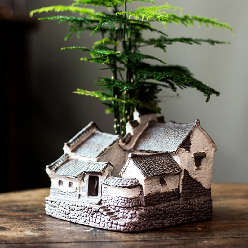 Micro-paysage avec pot céramique et succulentes