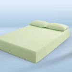 parure lit bleu clair drap housse élastique deux oreillers coton doux chambre moderne