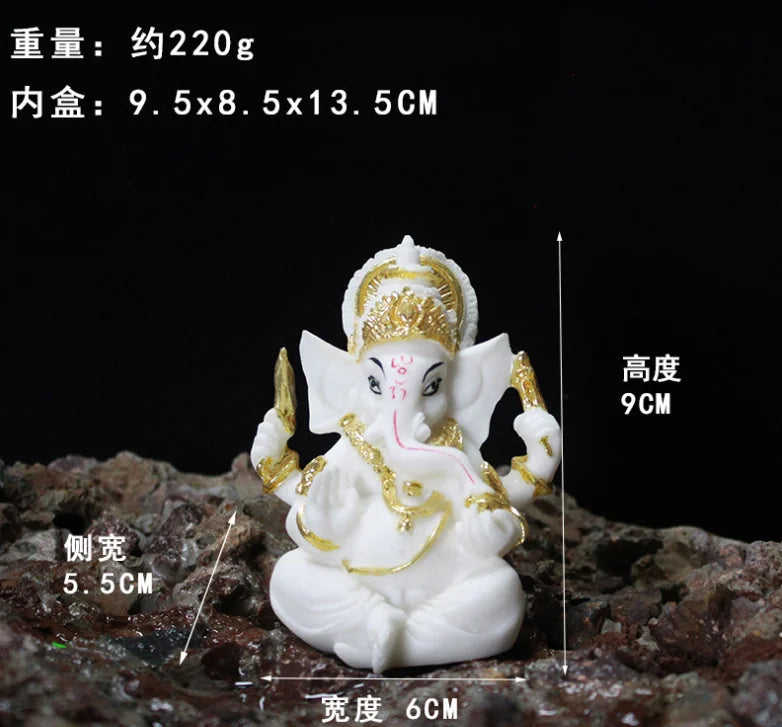 statue ganesha blanc doré relief sculpté artisanal cérémonie mariage anniversaire évenement