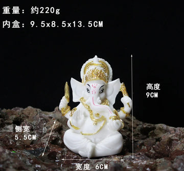 statue ganesha blanc doré relief sculpté artisanal cérémonie mariage anniversaire évenement