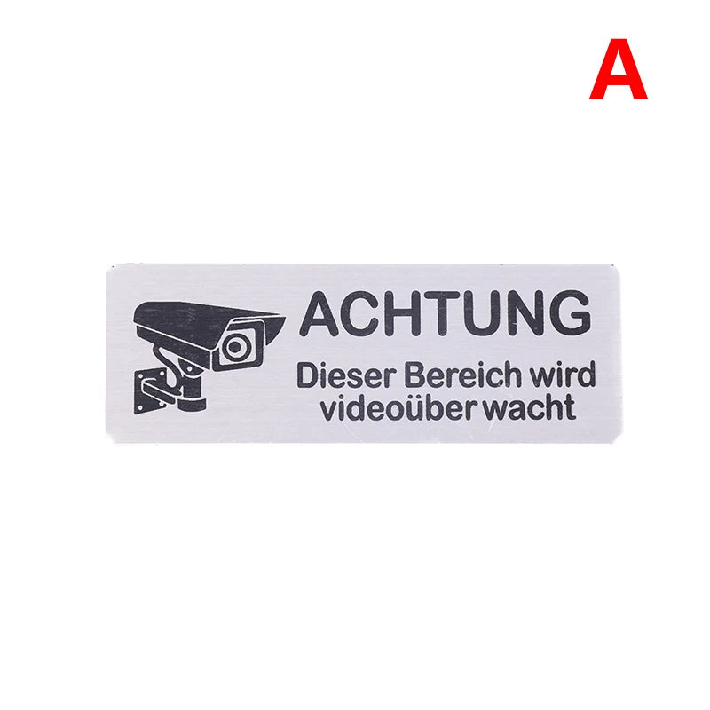 panneau signalétique argenté achtung surveillance vidéo adhésif caméra texte avertissement graphique simple porte