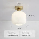 lampe moderne dorée striée vis fixations certifications multiples 20cm 26cm