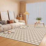 Un salon douillet et élégant avec un canapé moelleux, une table basse en bois et un tapis à motifs géométriques qui apportent une touche de style à cette pièce accueillante.